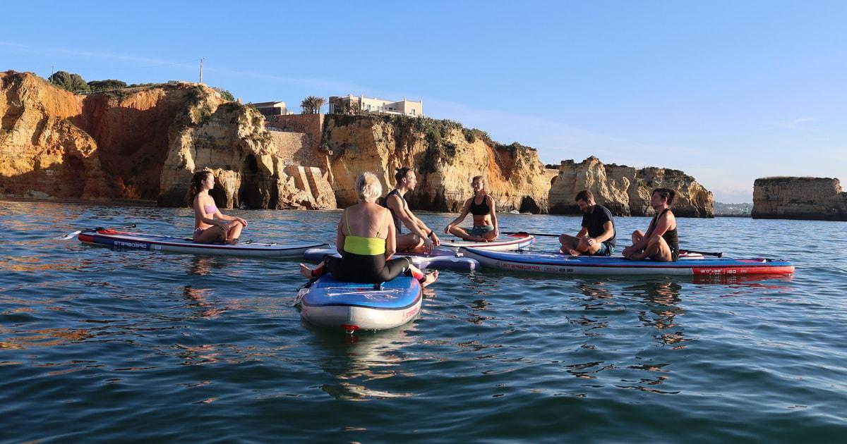 Lagos: Sunrise SUP Yoga Experience at Praia dos Estudantes